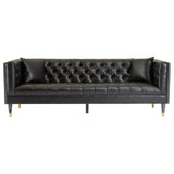 A three-seat sofa upholstered in black faux leather, featuring a tufted backrest and sleek, gold-colored legs. The design includes armrests with a modern, angular shape, creating a stylish and contemporary look suitable for various living spaces