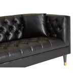 Black faux leather sofa featuring a tufted design on the backrest and seat, with sleek, tapered legs. The sofa has a modern aesthetic, suitable for contemporary living spaces