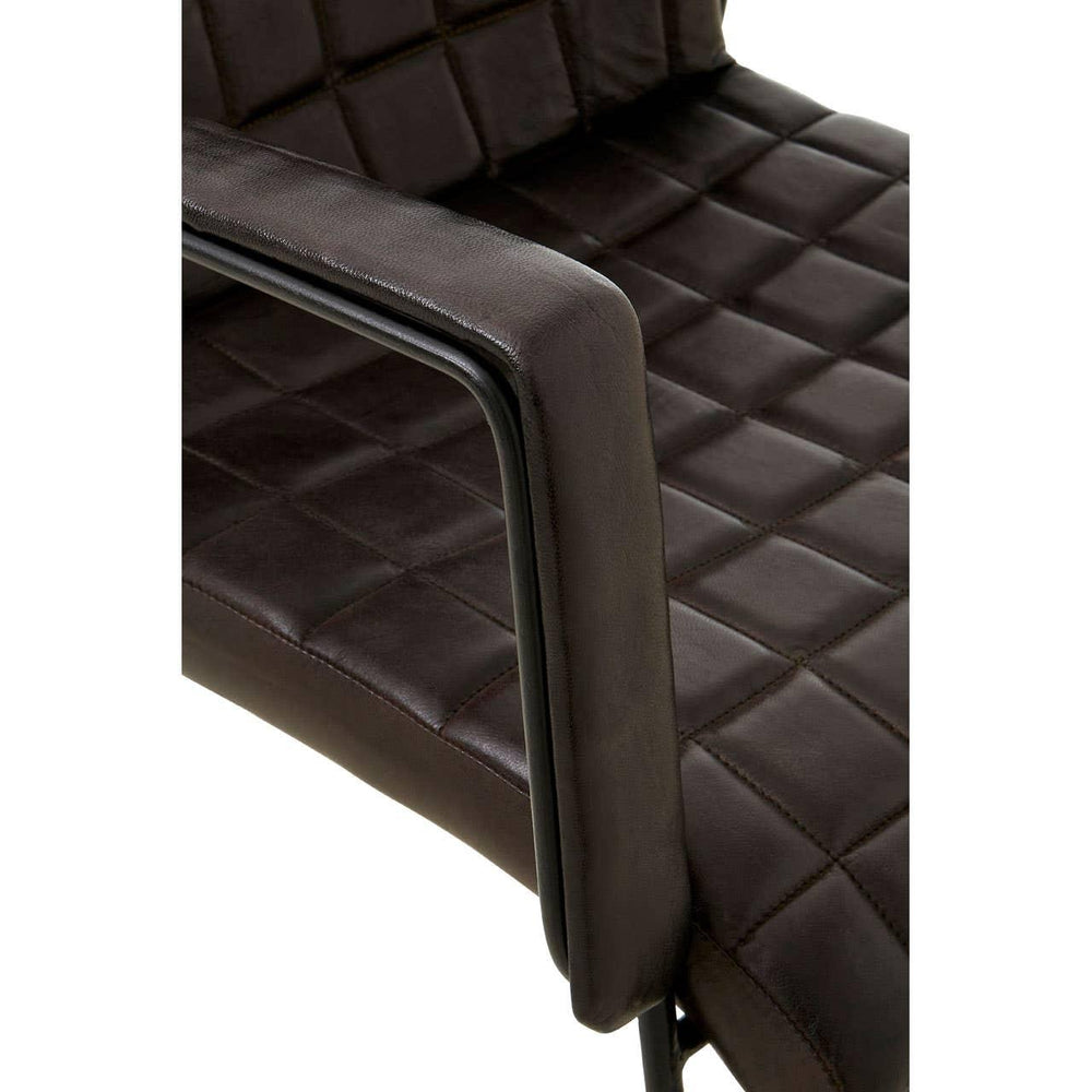 Brown faux leather dining chair with quilted seat detail and metal armrest, close view