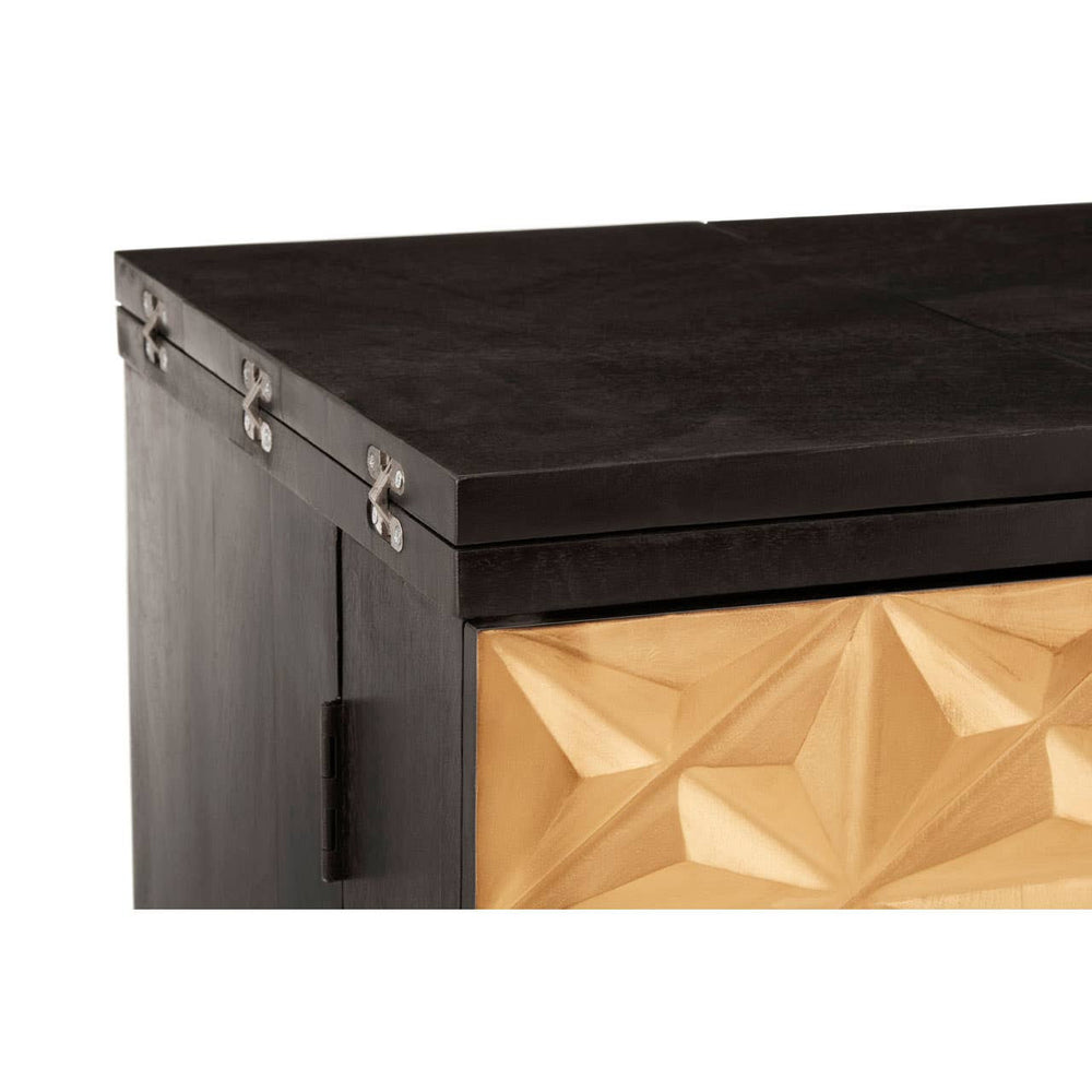 The top corner of a bar cabinet featuring a sleek black mango wood surface with a textured gold and black geometric design on the front. The cabinet showcases a modern aesthetic with clean lines and a polished finish