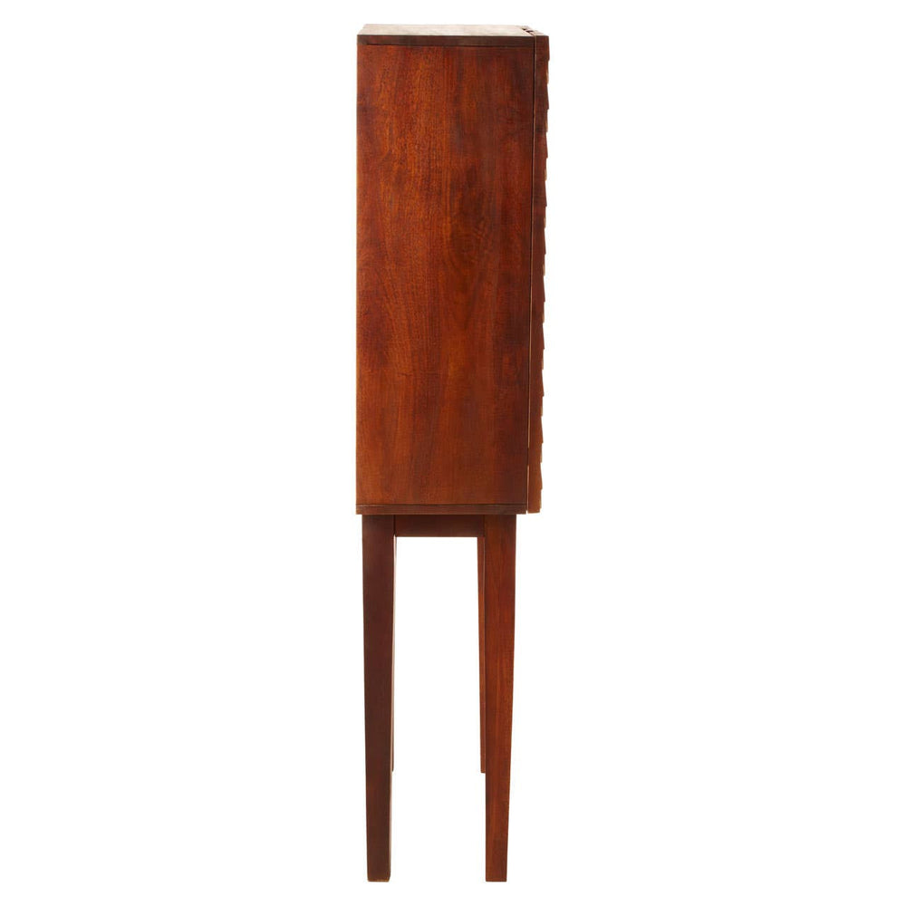 Tall cabinet made of carved mango wood with a rich brown finish, featuring a cylindrical shape and four slender legs. The design highlights the natural grain of the wood, providing a coastal aesthetic suitable for home decor