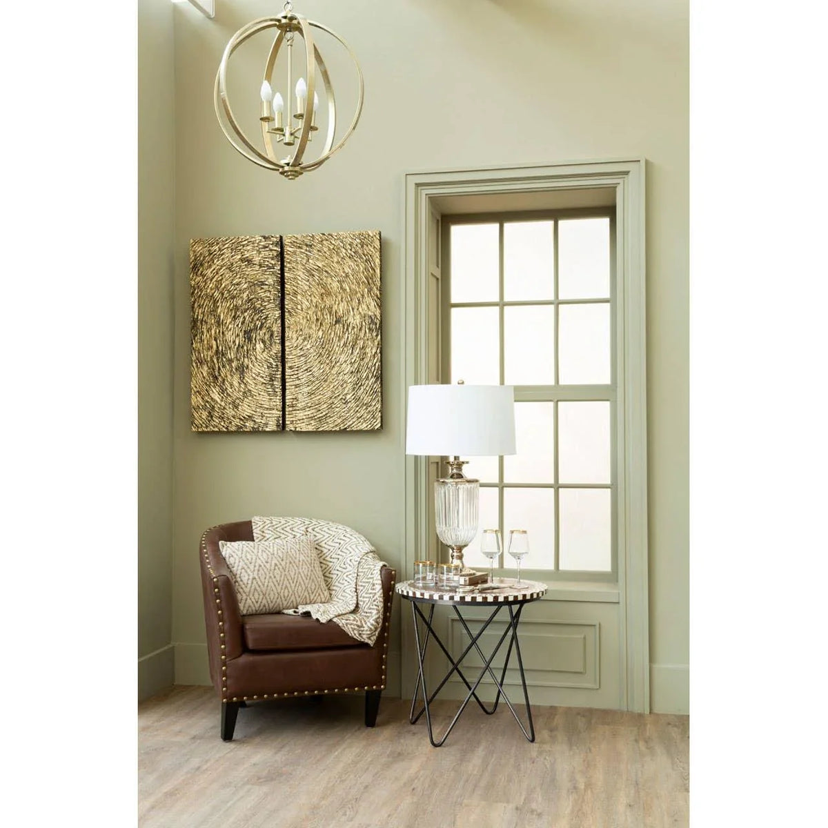 Brown accent chair with cushion beside round side table and lamp in modern living room corner