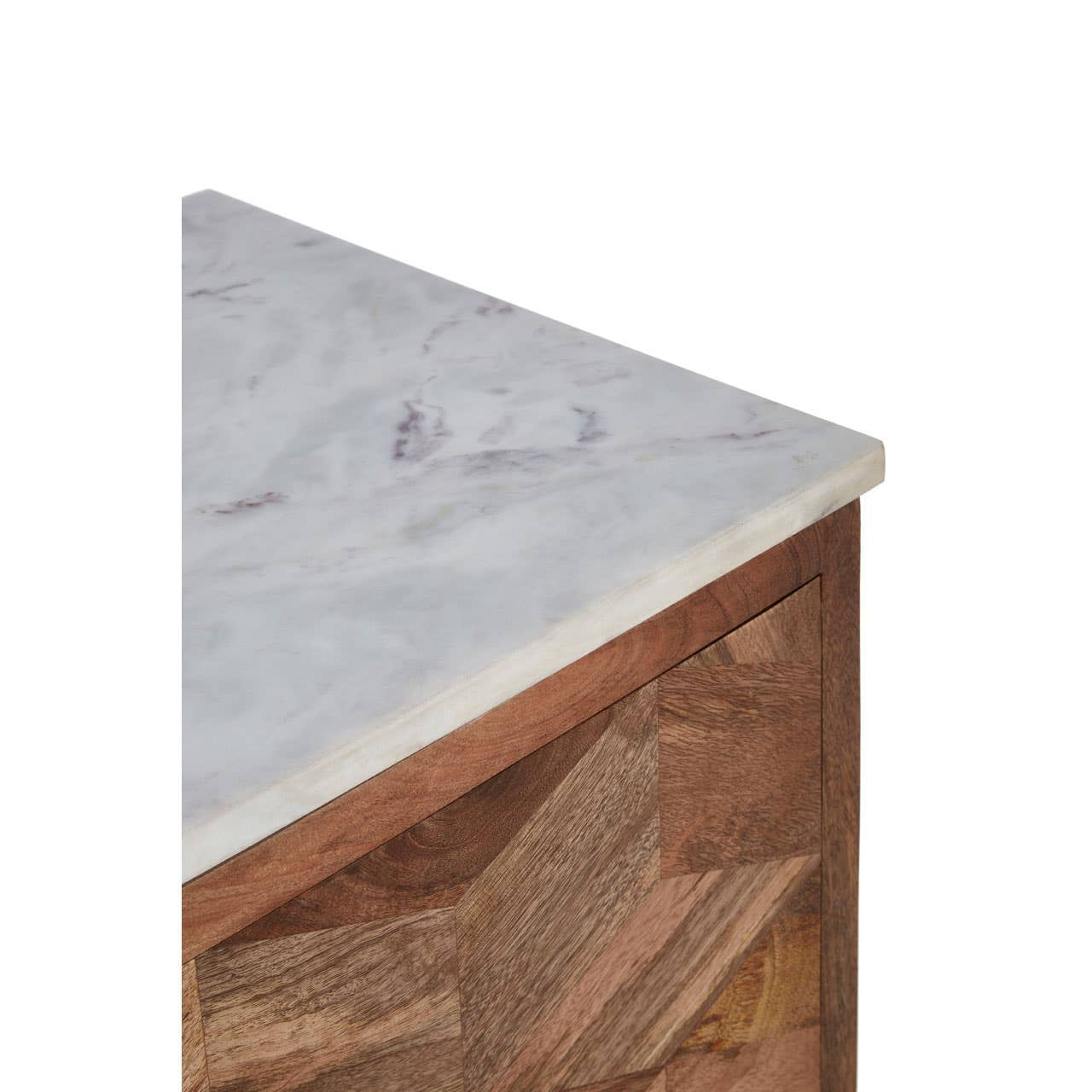 The top corner of a cabinet featuring a smooth white marble surface with subtle gray veining, complemented by a geometric design made of warm-toned mango wood on the front. The cabinet's edges are clean and modern, showcasing the contrast between the marble and wood materials