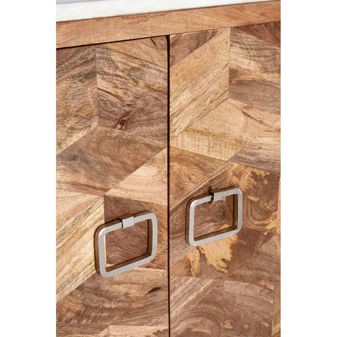 Close-up view of a cabinet featuring a geometric design made from mango wood, showcasing a rich wood grain pattern. The cabinet has two doors with sleek square metal handles, highlighting a modern aesthetic. The top surface appears to be made of marble, adding an elegant touch to the overall design