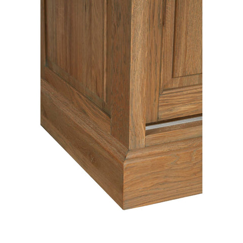 Close-up view of the base of the Lyon Oak Wood Tall Cabinet, showcasing the washed grey finish and detailed wood grain texture. The cabinet features a sturdy, rectangular design with clean lines and a subtle paneling effect on the sides