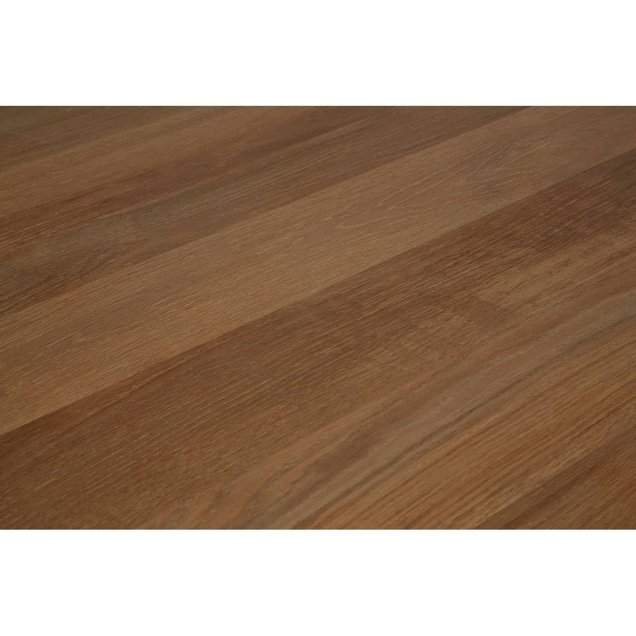 Close-up of oak dining table top with visible wood grain texture and smooth finish