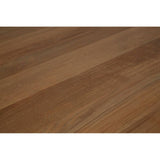 Close-up of oak dining table top with visible wood grain texture and smooth finish