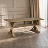 Wooden dining table with trestle legs on oak flooring in a bright room