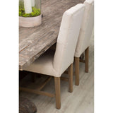 Rustic wooden dining table with beige upholstered dining chairs on wood floor