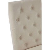 Beige fabric dining chair with button-tufted backrest, close-up angle