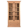 Tall cabinet with a washed grey finish, featuring a wooden frame, two glass-paneled doors with multiple grid sections, and two lower drawers. The cabinet has a classic design with a decorative top and a smooth surface
