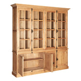 Large cabinet made of natural oak wood featuring multiple glass-paneled doors, showcasing adjustable shelves inside. The cabinet has a sturdy base with a central open section and two lower doors for additional storage. The wood finish highlights the grain and texture, giving it a warm, rustic appearance