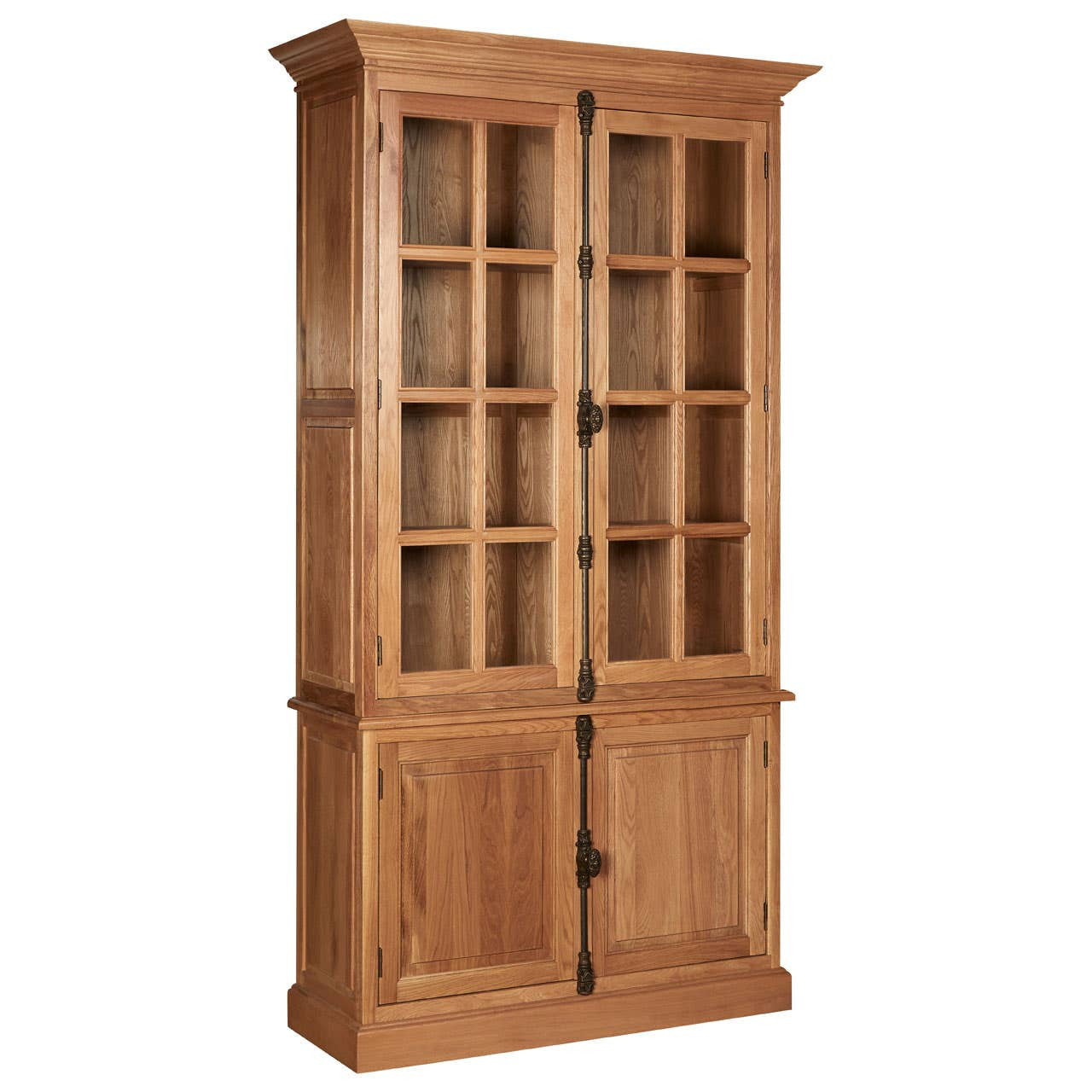 Tall cabinet made of natural oak wood featuring a classic design with glass-paneled doors at the top and solid wood doors at the bottom. The cabinet has a warm, light wood finish and is adorned with black metal handles, providing a stylish storage solution for home decor or kitchen items