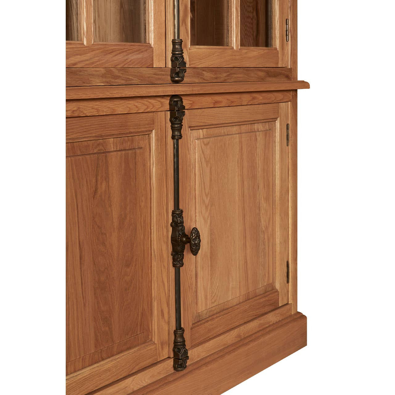 Natural oak wood tall cabinet featuring a smooth finish, decorative metal hardware, and a combination of glass and wooden doors. The cabinet has a sturdy base and showcases the wood's natural grain and texture