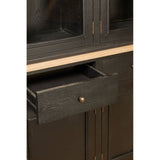 Close-up view of a black oak wood cabinet featuring a single drawer with a round handle, showcasing a sleek design and a smooth finish. The cabinet has a minimalist aesthetic with clean lines and a natural wood grain texture