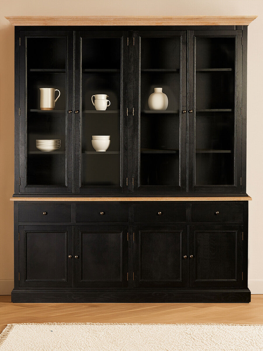 Large cabinet made of black oak wood featuring four glass-paneled shelves displaying decorative items, with a solid lower section that includes two doors. The cabinet has a sleek, modern design and is set against a neutral wall