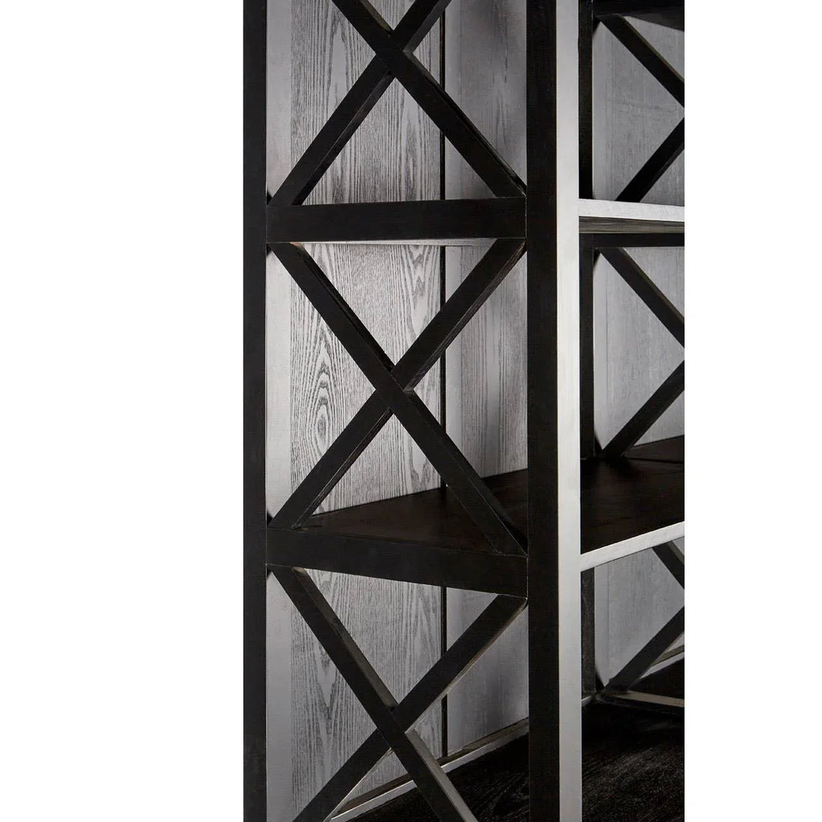 Black metal bookcase with cross-brace detail and dark wood shelves, close side view
