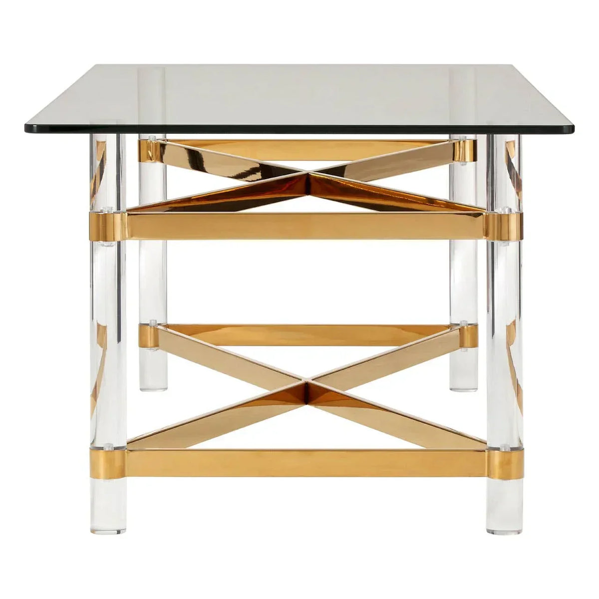 Glass top dining table with gold cross frame and clear acrylic legs, front view