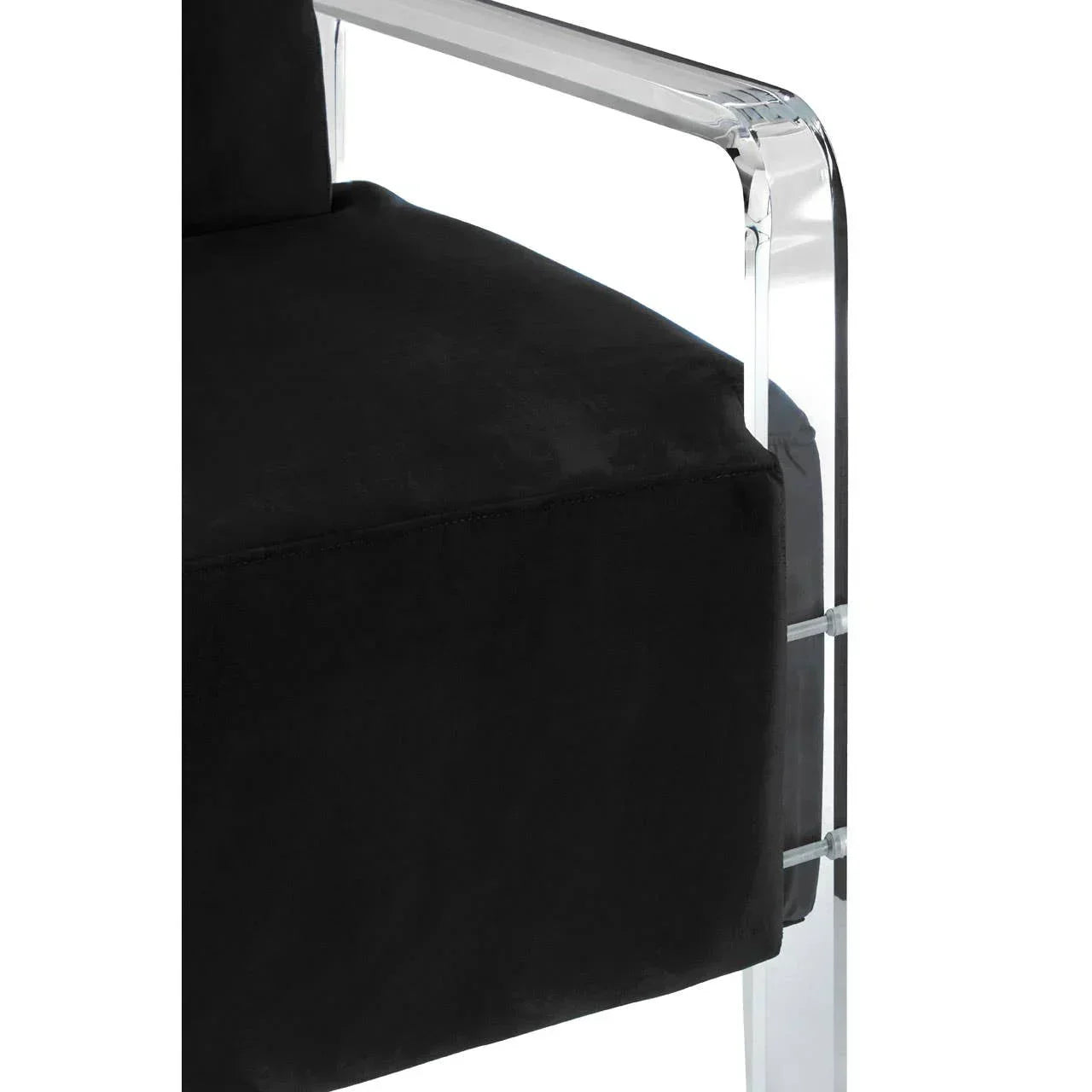 Black velvet armchair with clear acrylic armrest close-up