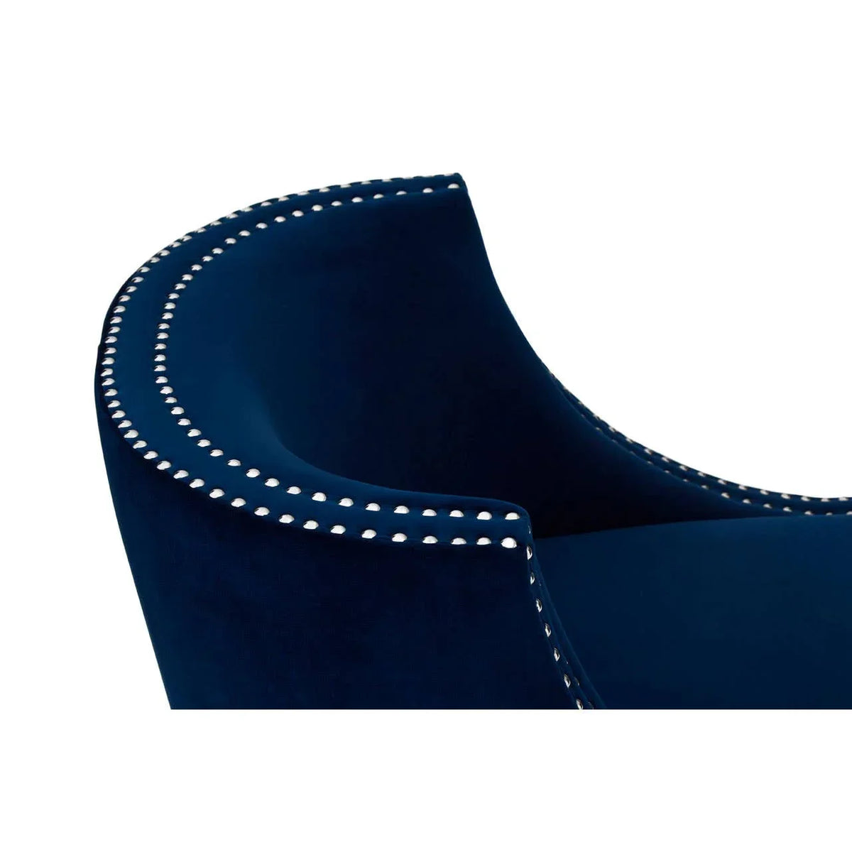 Closeup of blue velvet sofa arm with silver stud detailing