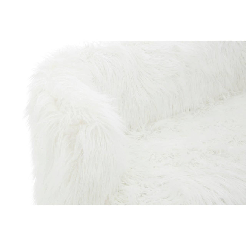 Soft white fur-effect upholstery covers the armrest of a two-seater sofa, showcasing a plush texture. The sofa features sleek gold legs that add a touch of elegance to the design