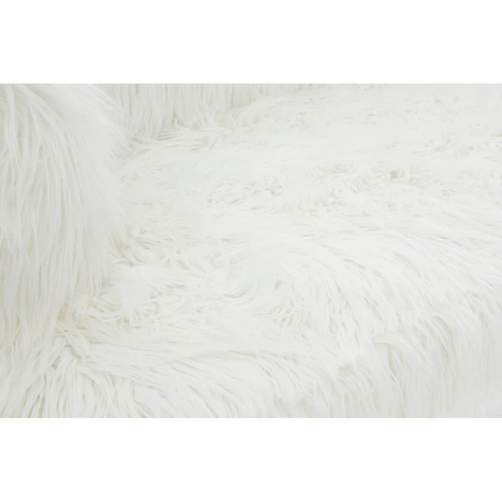 Soft, fluffy white upholstery with a fur effect, showcasing a cozy texture. The fabric appears inviting and plush, ideal for a comfortable seating experience