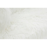Soft, fluffy white upholstery with a fur effect, showcasing a cozy texture. The fabric appears inviting and plush, ideal for a comfortable seating experience