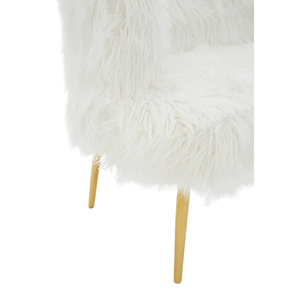 Soft white fur-effect upholstery covers the seat of a two-seater sofa, complemented by sleek gold legs that elevate the design. The texture appears plush and inviting, creating a cozy aesthetic suitable for modern home decor