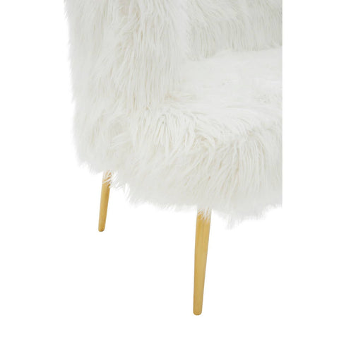 Soft white fur-effect upholstery covers the seat of a two-seater sofa, complemented by sleek gold legs that elevate the design. The texture appears plush and inviting, creating a cozy aesthetic suitable for modern home decor