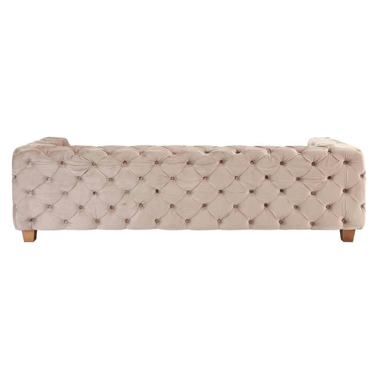 Beige velvet sofa with a tufted design, featuring three seats and rounded armrests, supported by wooden legs. The fabric has a soft texture, and the overall style is elegant and modern