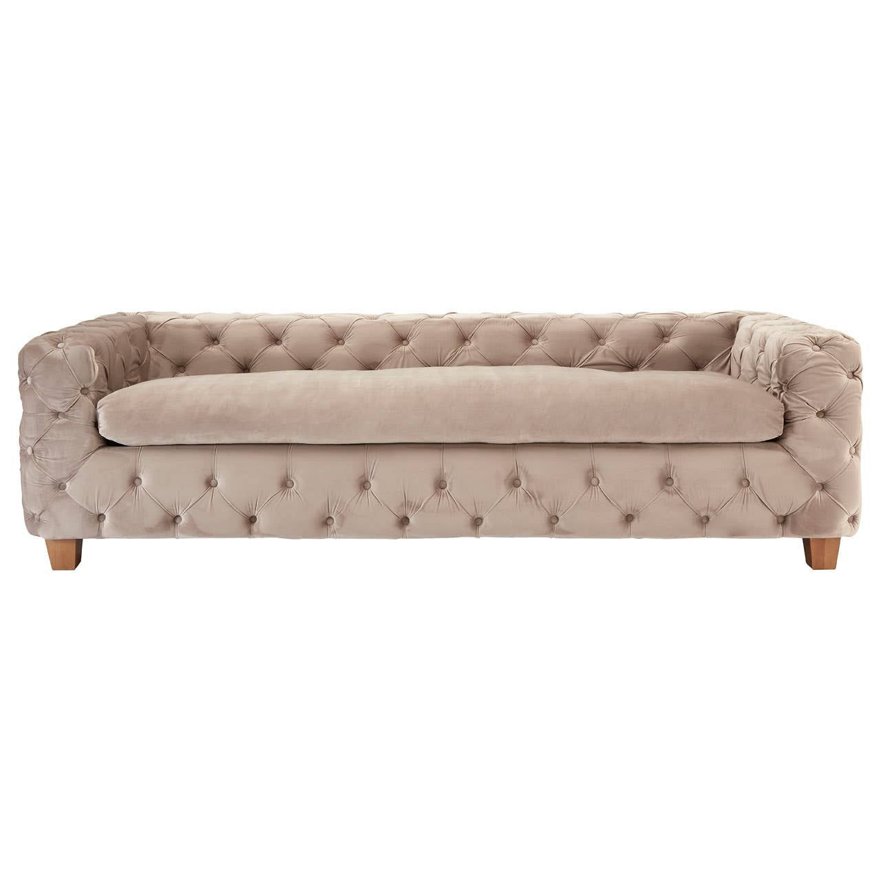 Beige velvet sofa with a tufted design, featuring a low back and thick seat cushion, supported by wooden legs. The overall style is elegant and modern, suitable for a living room setting