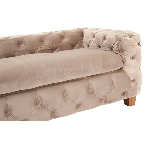 Beige velvet sofa with tufted upholstery and wooden legs, featuring a three-seat design and rounded arms