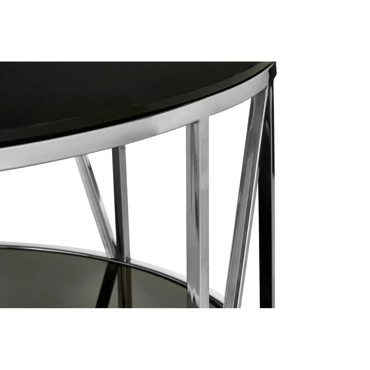 Round glass side table with chrome frame, close-up on legs and black tabletop