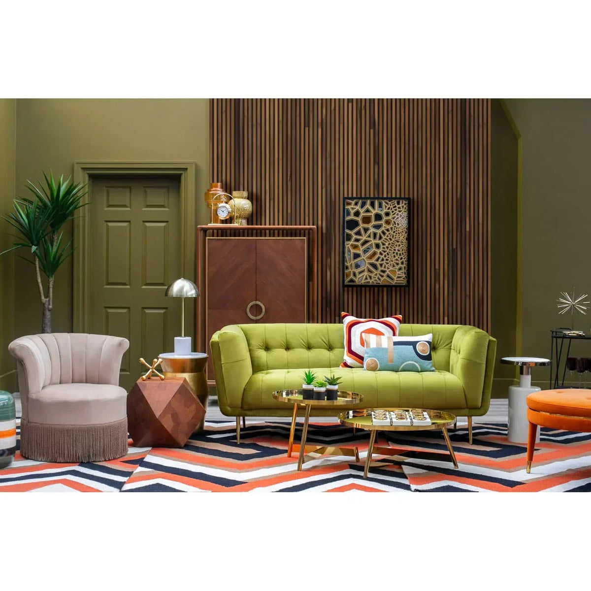 Green upholstered sofa set with accent cushions in modern living room, geometric rug and decor