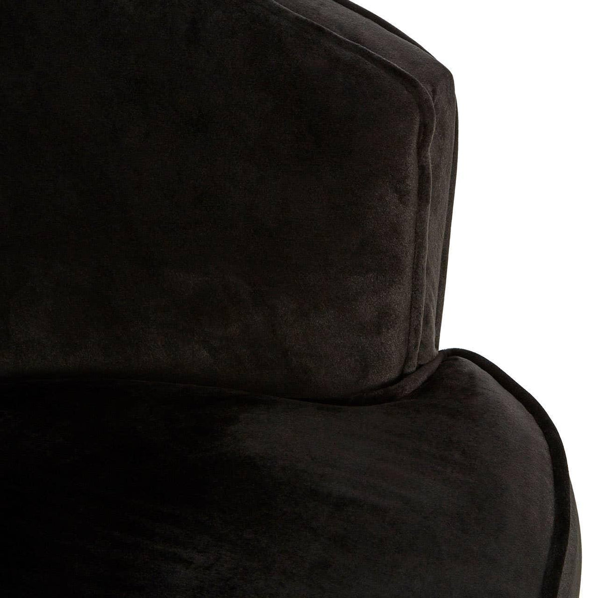 Close-up of black velvet sofa cushion and backrest upholstery