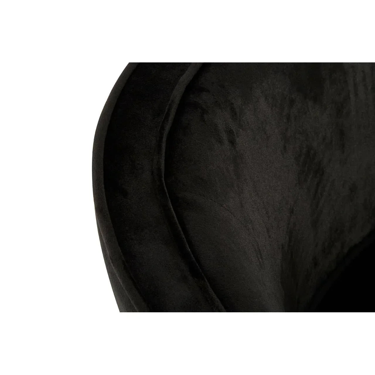 Close up of black velvet armchair upholstery texture and curved backrest