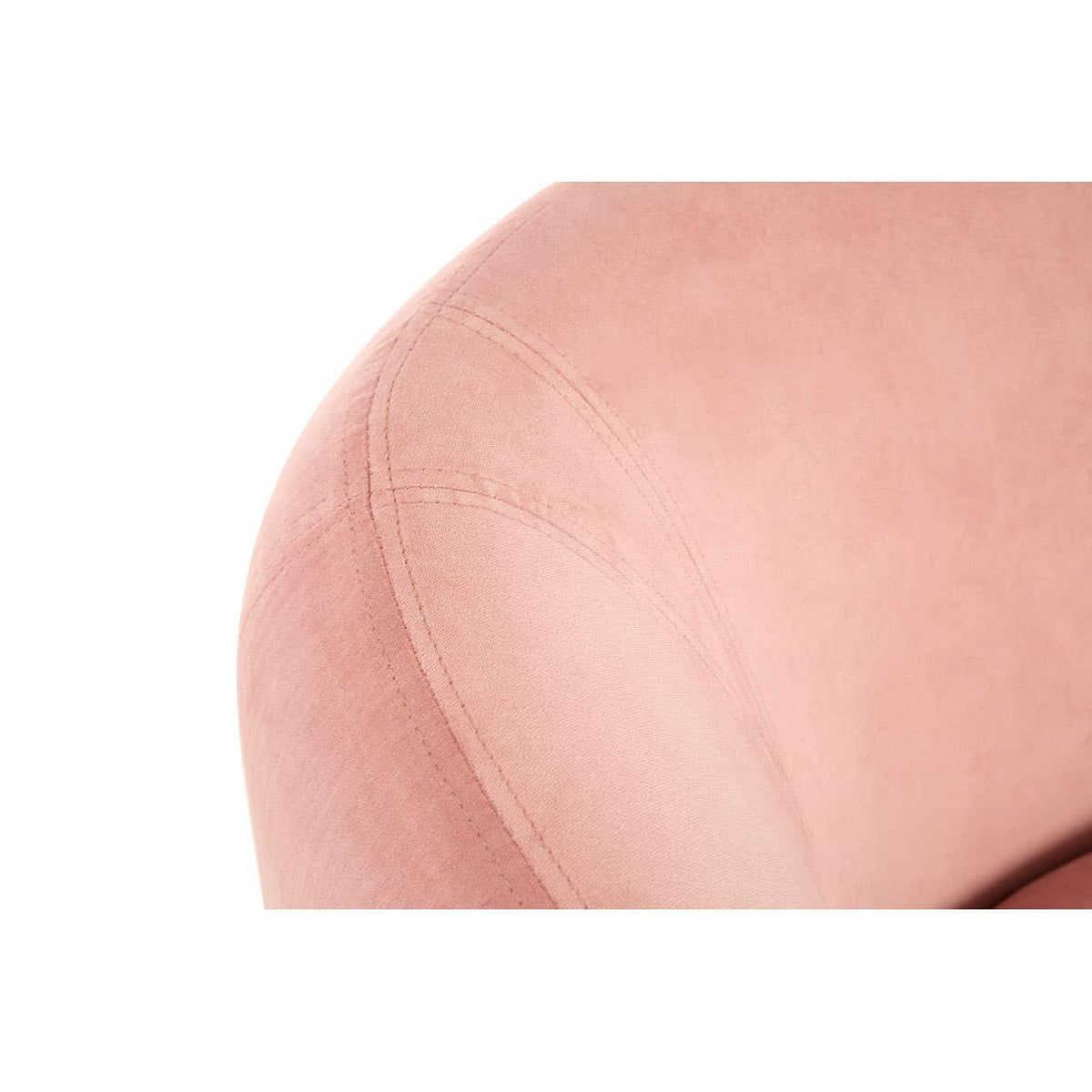 Closeup of pink velvet chair fabric with seam detail