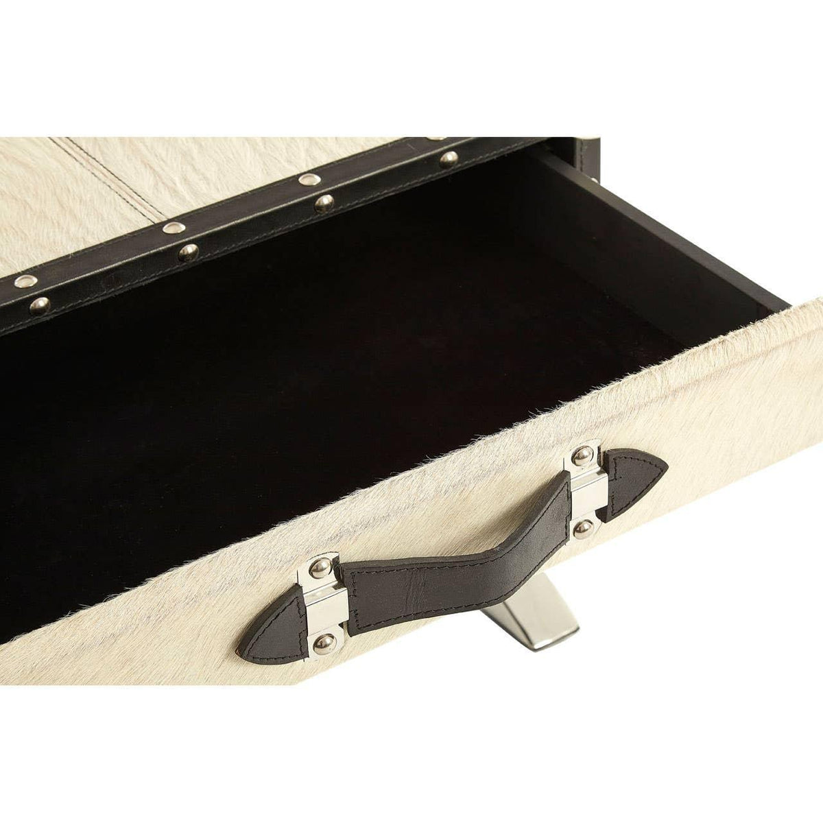 Close-up of cream storage drawer with metal handle and dark interior, accented with studs