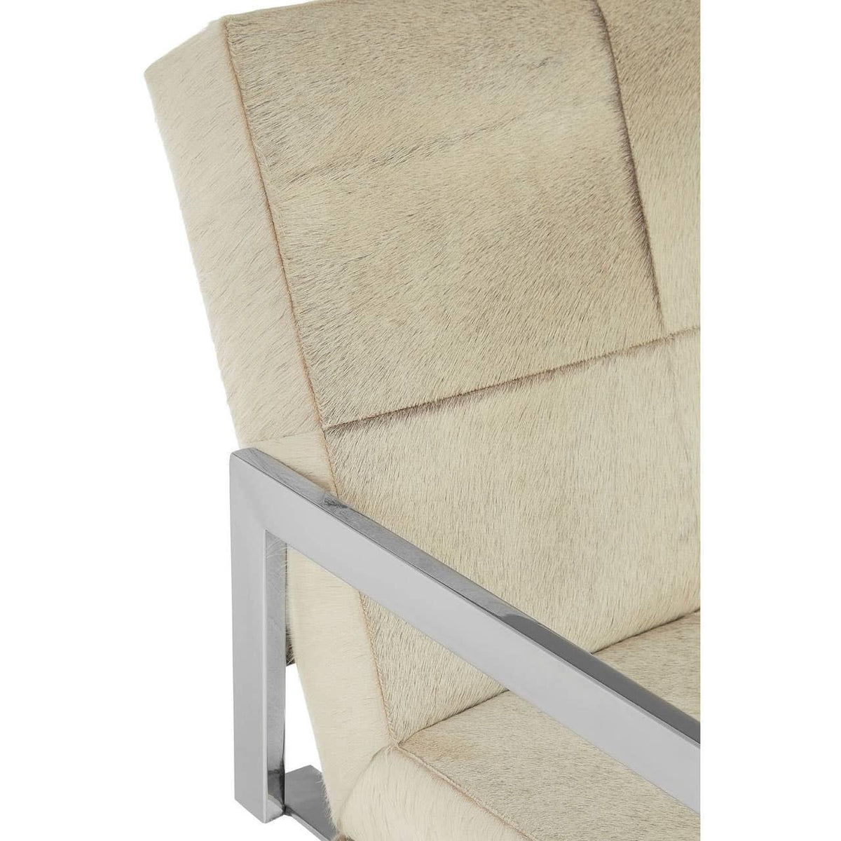 Beige faux fur armchair with brushed metal frame, close-up of seat and backrest