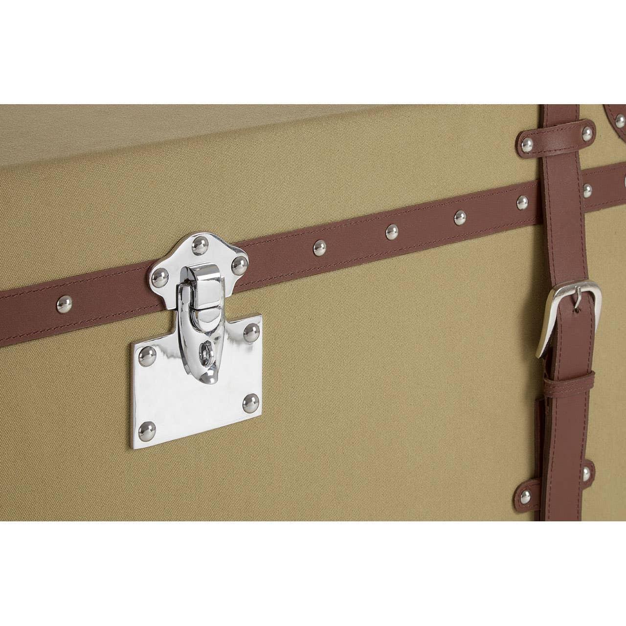 Beige storage trunk with brown leather trim and silver hardware detail close-up