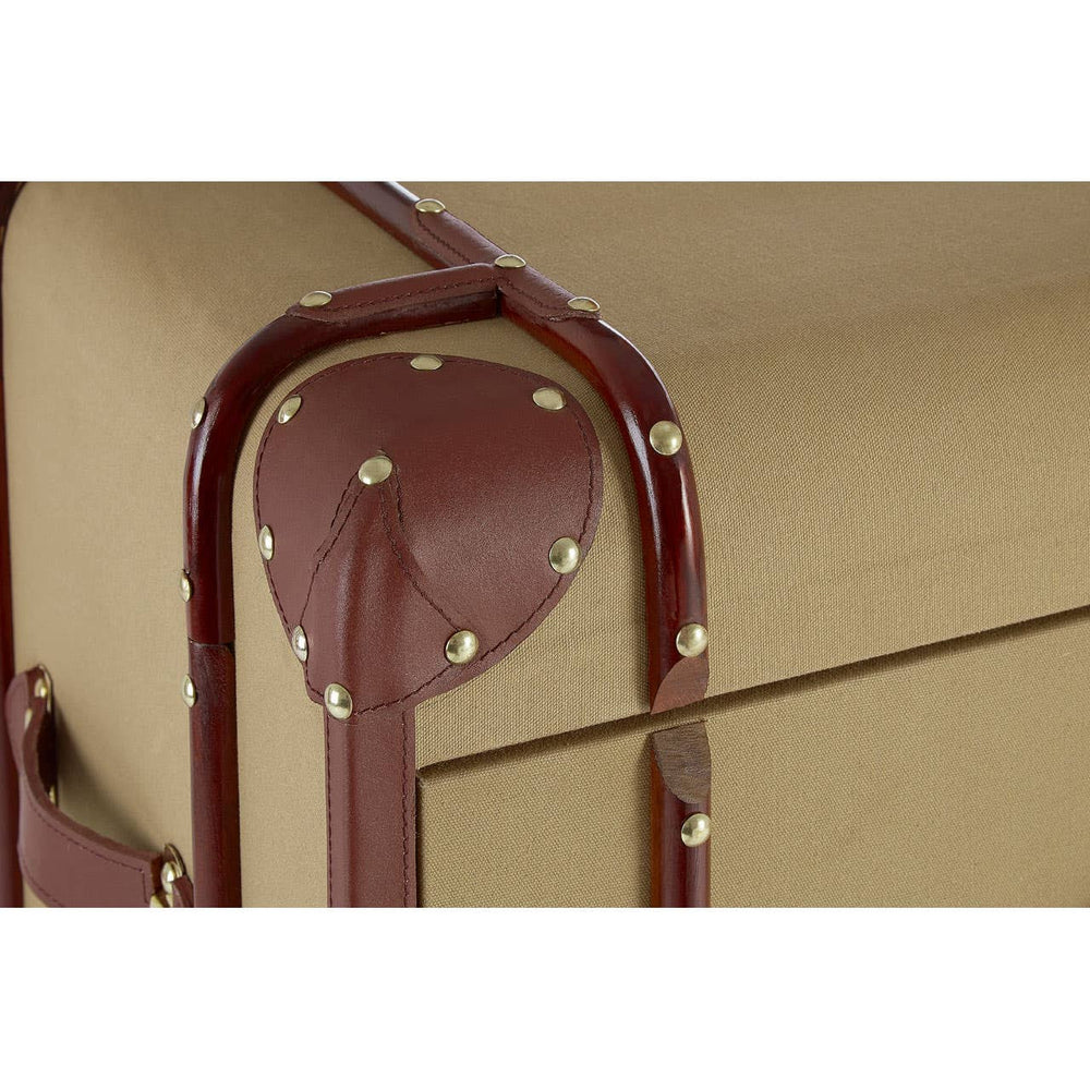 Close-up view of the Columbus Trunk Style Chest featuring two drawers, showcasing the beige exterior with decorative brown accents and metal studs. The trunk has a rounded handle and a sturdy design, emphasizing its vintage-inspired aesthetic