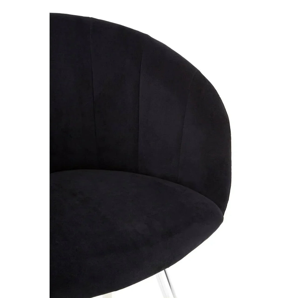 Black velvet accent chair with curved backrest and silver metal legs, close-up angle