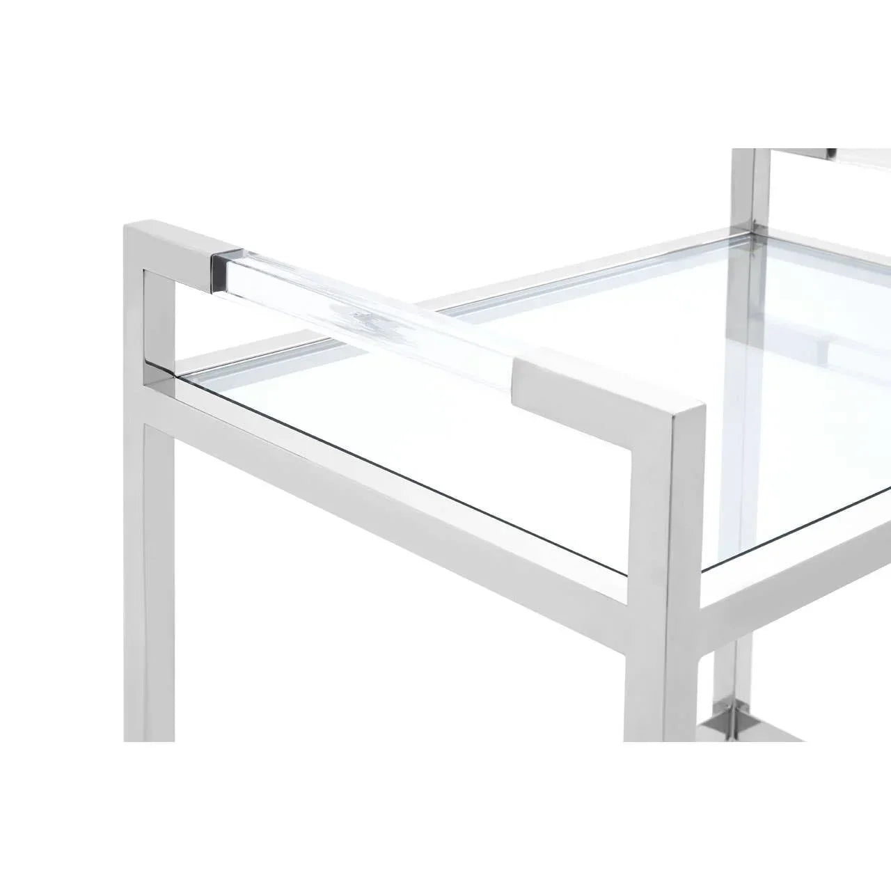 Modern glass coffee table with chrome frame and clear acrylic arm detail, close-up view