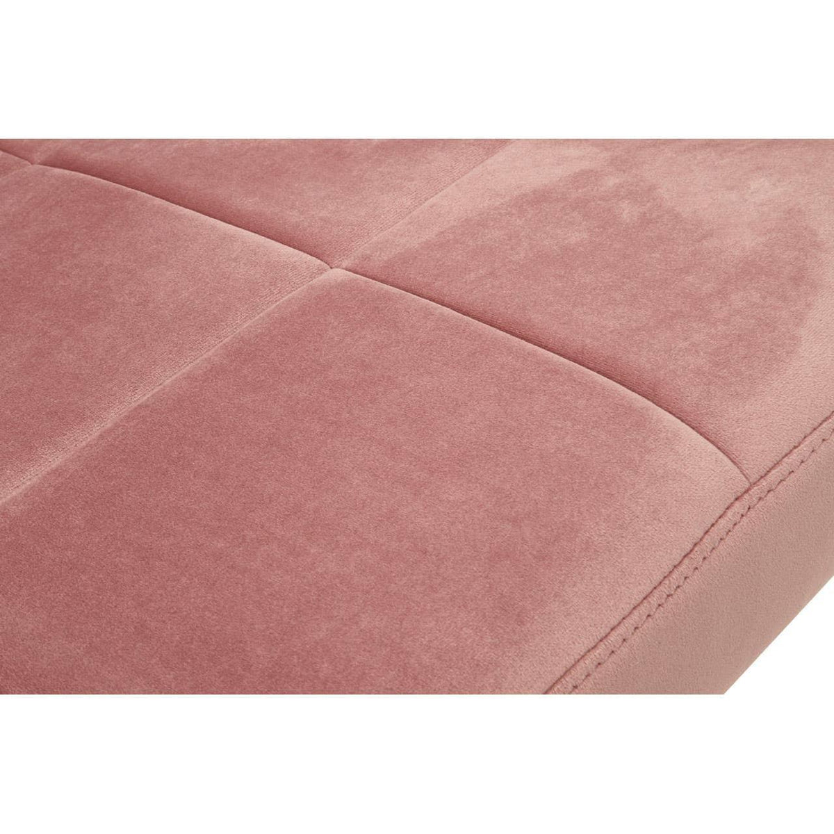 Close up of pink upholstered sofa cushion with square stitched detail