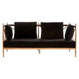 Two-seater sofa featuring a sleek black velvet upholstery and a stylish rose gold frame, with two plush back cushions and two round accent pillows for added comfort. The design showcases clean lines and a modern aesthetic, making it a chic addition to any living space