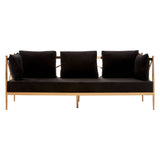 A sleek three-seater sofa featuring a luxurious black velvet upholstery and a stylish rose gold frame. The sofa has three plush cushions for added comfort, with a minimalist design that highlights its elegant lines and modern aesthetic