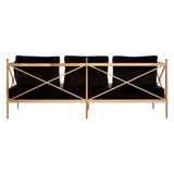 Three-seater sofa featuring a sleek black velvet upholstery and a stylish rose gold frame, showcasing a modern design with a crisscross pattern on the backrest. The sofa is positioned upright, highlighting its elegant silhouette and plush cushions