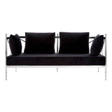 A sleek two-seater sofa featuring a black velvet upholstery and a shiny silver metal frame. The sofa has two plush back cushions and two additional side cushions, all in matching black velvet, providing a modern and elegant look suitable for contemporary living spaces