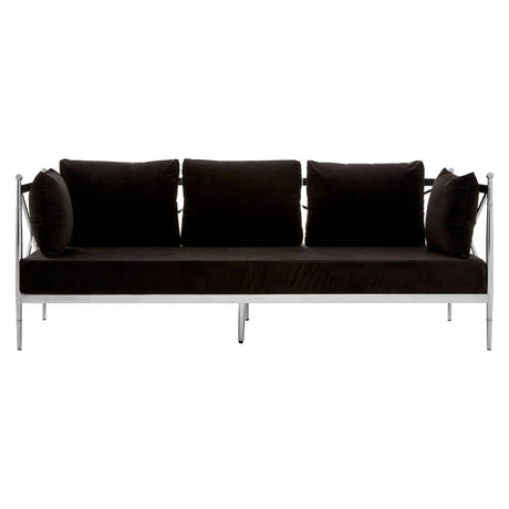 Three-seater sofa upholstered in black velvet, featuring a sleek silver frame. The sofa has three plush back cushions and two round side cushions, all in matching black velvet. The overall design is modern and elegant, suitable for contemporary living spaces