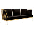 Black velvet three-seater sofa with a sleek gold finish frame, featuring a modern design and plush cushions. The sofa has a minimalist aesthetic with vertical gold accents on the sides and a smooth, luxurious texture